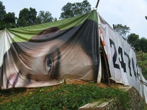 Hoarding (banner) used for tent siding, between Thekkady and Kochi, Kerala, 2010.