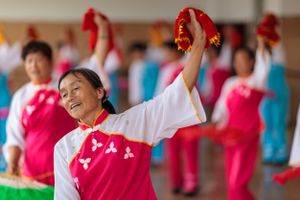 Students rehearse a traditional Chinese dance performance at a University of the Third Age (U3A).