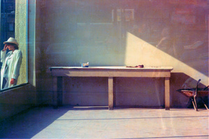 2 WOMEN WHEELBARROW IN WINDOW