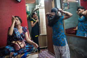 Husna, Manisha and Gomzi in the home they share near King's Circle Station in Mumbai  © Alison McCauley