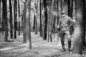 An Indonesian man dressed up as a German Waffen-SS sergeant takes a break and smokes a cigarette during a gathering of re-enactment enthusiasts in Cibubur, East Jakarta, Indonesia.
