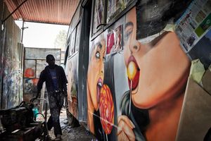 In the Buru Buru Phase 1 district of Nairobi, craftsmen are pimping matatus in a garage. The matatus in Nairobi are very numerous and must always be decorated with new themed motifs in order to stand out from the competition and remain attractive to passengers.