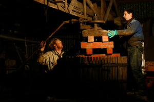 Addition of wood blocks as the apples are squeezed and lose volume
