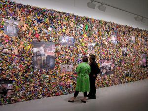 From the series "The Real Toy Story," Wolf's first major art project. The work was inspired by Wolf's childhood fascination with plastic toys (which were forbidden to him by his parents). By scouring the California coast, Wolf gathered over 20,000 toys which, when combined with portraits of Chinese workers, produced his first investigation into the broader contours of urban life.