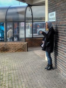 5 Girl smoking at bus station