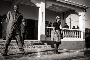 Churchmembers Leonard Gibbs and Olive Berkel on the steps of the Adventist church