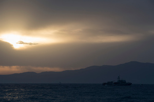 The Greek Coastguard intercepts refugees' boats and takes all refugees crossing from Turkey aboard. March 13, 2016, Lesvos, Greece