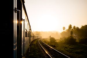 Shortly after sunrise, the sunlight illuminates the carriages of the Kandy to Ella train in Sri Lanka.