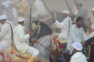 Tbourida riders , grouping after a charge amidst the power smoke. Tissa , Morocco