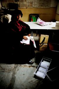A vaccinator collects and makes a record of vaccine from a cold chain in Bhiwandi, Maharashtra