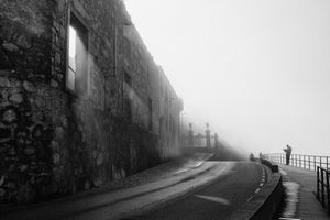 Reading the newspaper on a foggy morning