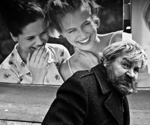 Older man passing by store billboard appears mocked by young women in advertisement, pedestrian mall, downtown Dnipropetrovsk (now Dnipro) Award  winner