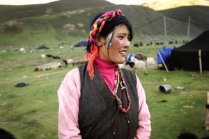 Nomad woman outside her family's encampment at elevation 16,300 feet between Lhasa and Bayi. © Forest McMullin