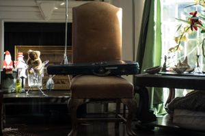 Closed violin case on chair in Darren's studio