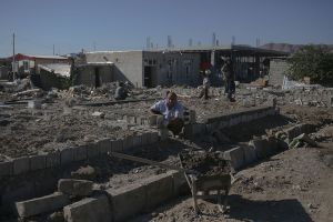 Some of villagers took action and started to mend their destroyed homes with materials they have in access