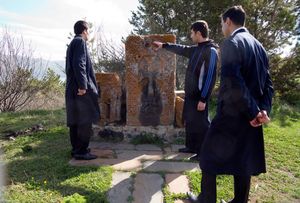 Armenia, student priest visit the grave of  a deceased  abbot                      © Bert Spiertz