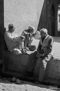 Old friends sitting in the village plaza | Dhanda, Punjab.